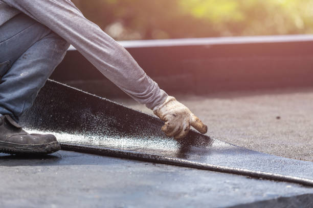 Professional Basement Waterproofing technician working in Williamsburg, PA